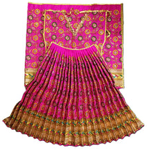 Load image into Gallery viewer, A traditional Indian lehenga choli set in vibrant magenta pink, featuring intricate gold zari embroidery, floral patterns, and a pleated skirt with a wide gold border, displayed against a solid white background.
