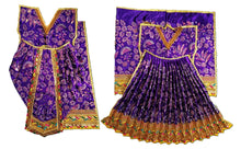 Load image into Gallery viewer, A traditional Indian ethnic outfit displayed flat against a white background, featuring a purple and gold patterned kurta with a matching pleated skirt and a coordinating sari.