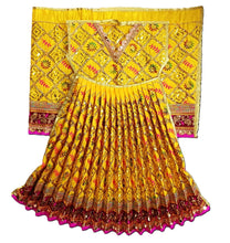 Load image into Gallery viewer, A traditional Indian ethnic outfit consisting of a pleated yellow skirt with orange and gold patterns and a matching embroidered yellow blouse, displayed against a solid white background.
